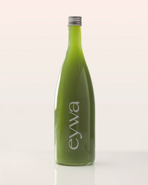 Green organic celery juice bottle with 'eywa' branding on a white background